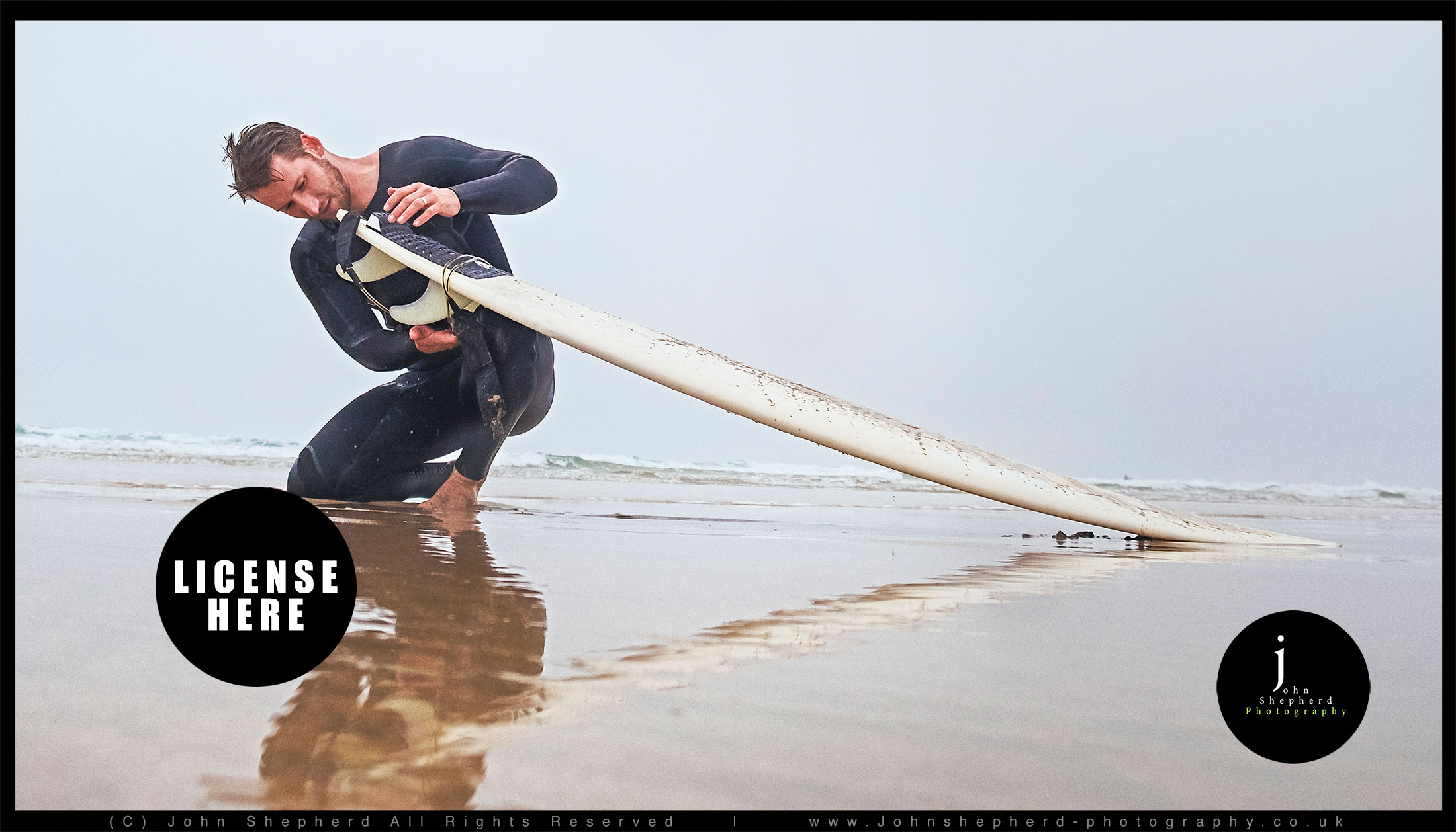 Surfer Preparing his surfboard.